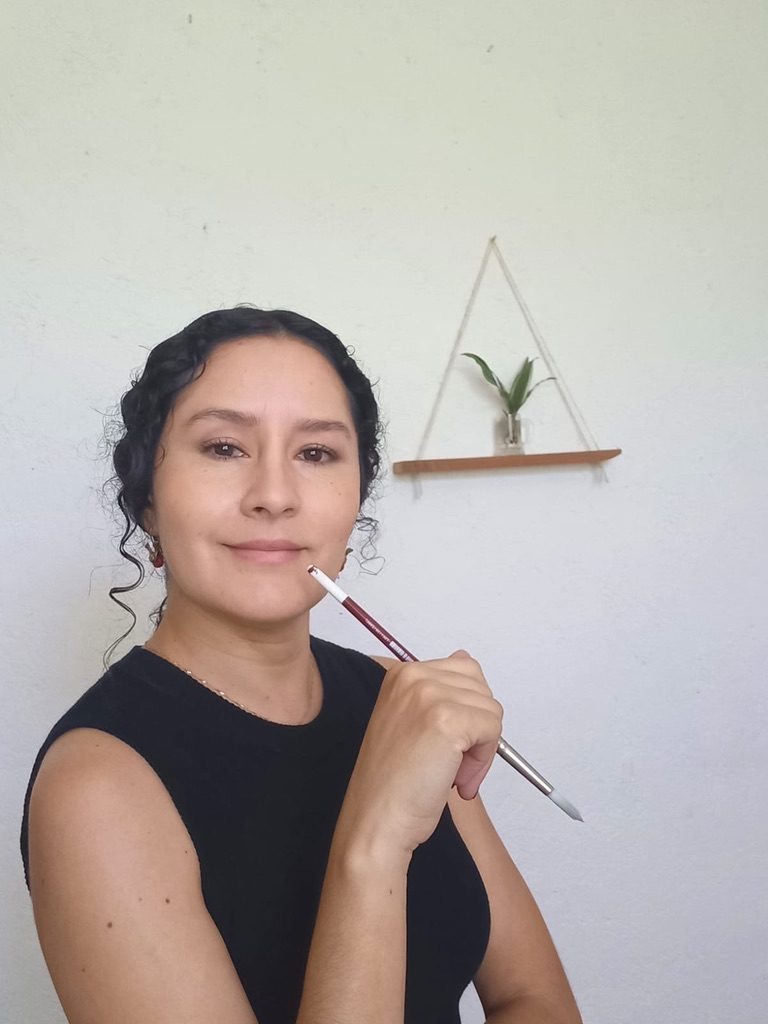 Raquel Palacios Vega smiling at home, in a black top